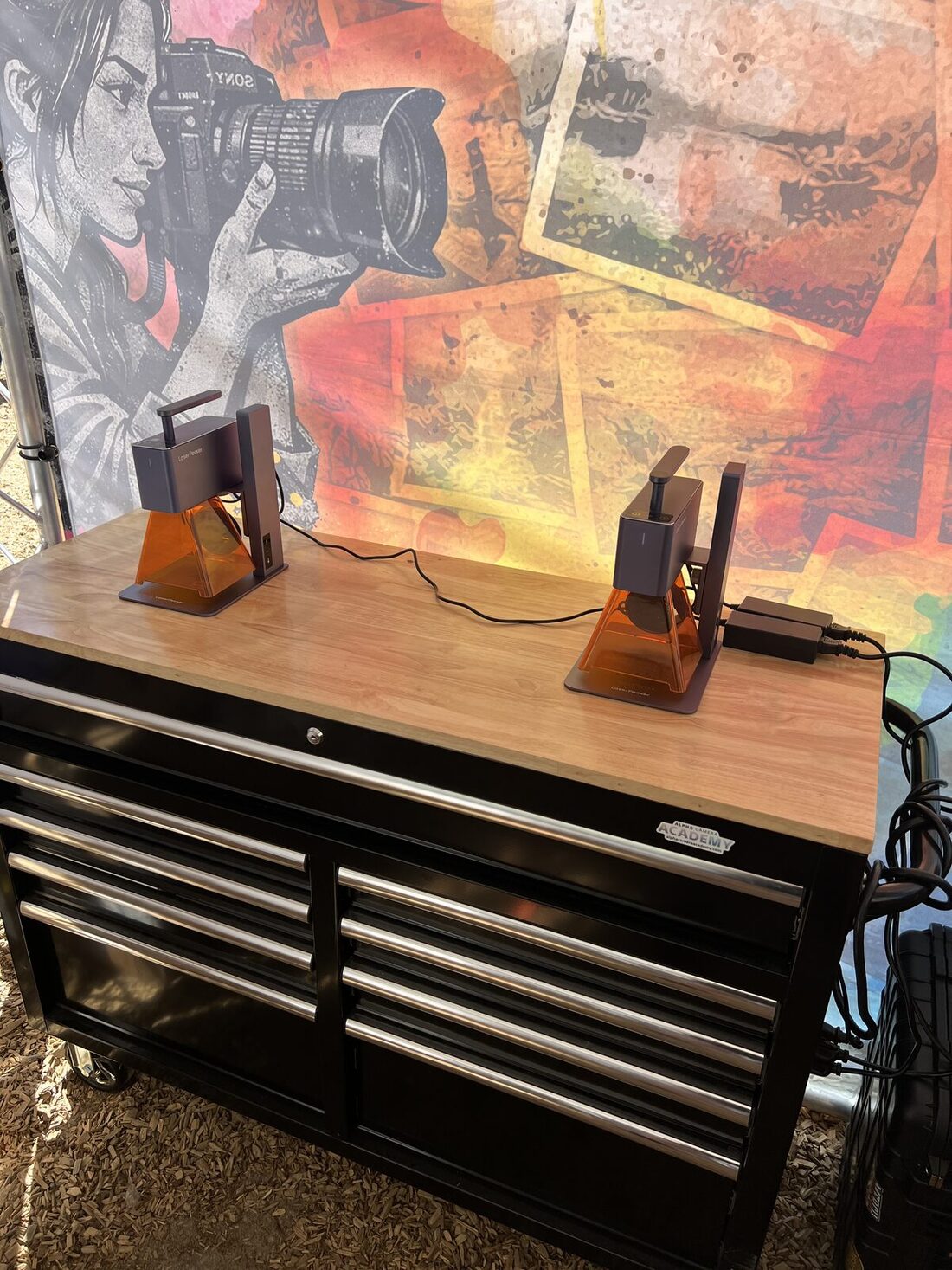 Laser engraving add-on station personalizing hard goods beside the embroidery bar